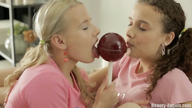 Pretty cuties share big lollipop and tiny vibrator