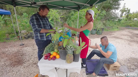 Exotic woman is selling fruits while outdoors