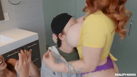 Busty redhead and a teen are double teaming a lad